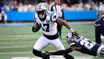 Dec 15, 2024; Charlotte, North Carolina, USA; Carolina Panthers wide receiver Xavier Legette (17) with the ball as Dallas Cowboys cornerback Amani Oruwariye (27) defends in the first quarter at Bank of America Stadium.