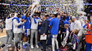 Mar 16, 2025; Nashville, TN, USA; The Florida Gators celebrate after defeating the Tennessee Volunteers in the 2025 SEC Championship Game at Bridgestone Arena. Mandatory Credit: Steve Roberts-Imagn Images