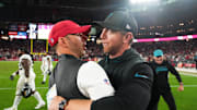 Nov 23, 2025; Glendale, Arizona, USA; Jacksonville Jaguars head coach Liam Coen greets Arizona Cardinals head coach Jonathan Gannon on the field after the game at State Farm Stadium. Mandatory Credit: Joe Camporeale-Imagn Images