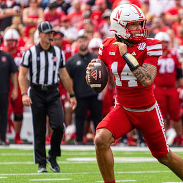 Sep 13, 2025; Lincoln, Nebraska, USA; Nebraska Cornhuskers quarterback TJ Lateef (14) scrambles against the Houston Christian Huskies during the third quarter at Memorial Stadium. Mandatory Credit: Dylan Widger-Imagn Images