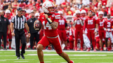 Sep 13, 2025; Lincoln, Nebraska, USA; Nebraska Cornhuskers quarterback TJ Lateef (14) scrambles against the Houston Christian Huskies during the third quarter at Memorial Stadium. Mandatory Credit: Dylan Widger-Imagn Images