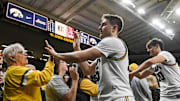 Nov 20, 2025; Iowa City, Iowa, USA; Iowa Hawkeyes guard Brendan Hausen (15) and forward Trey Thompson (20) greet fans after the game against the Chicago State Cougars at Carver-Hawkeye Arena. Mandatory Credit: Jeffrey Becker-Imagn Images