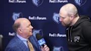 Dec 15, 2024; Los Angeles, California, USA; FanDuel Sports Network play-by-play announcer Paul Pranica (left) interviews Memphis Grizzlies coach Taylor Jenkins at Crypto.com Arena.