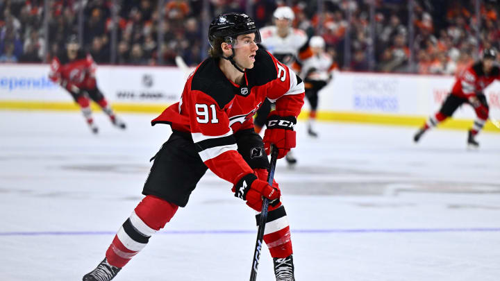 Apr 13, 2024; Philadelphia, Pennsylvania, USA; New Jersey Devils center Dawson Mercer (91) controls the puck against the Philadelphia Flyers in the second period at Wells Fargo Center. Mandatory Credit: Kyle Ross-USA TODAY Sports