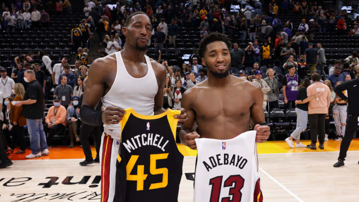 Nov 13, 2021; Salt Lake City, Utah, USA;  Miami Heat center Bam Adebayo (13) and Utah Jazz guard Donovan Mitchell (45) traded jerseys after the game at Vivint Arena. Miami Heat won 111-105. Mandatory Credit: Chris Nicoll-USA TODAY Sports