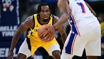 Oct 27, 2024; Indianapolis, Indiana, USA; Indiana Pacers forward Aaron Nesmith (23) looks at the ball controlled by Philadelphia 76ers guard Kyle Lowry (7) during the first quarter at Gainbridge Fieldhouse. Mandatory Credit: Marc Lebryk-Imagn Images