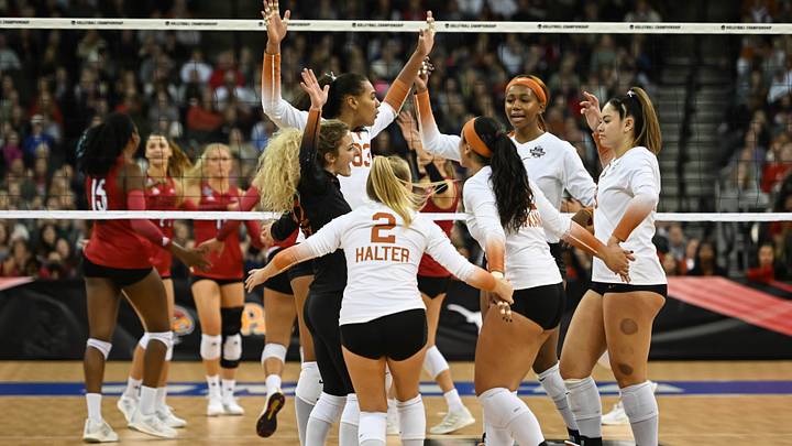Dec 17, 2022; Omaha, Nebraska, US; The Texas Longhorns celebrate after winning a point against the Louisville Cardinals at CHI Health Center. Mandatory Credit: Steven Branscombe-USA TODAY Sports Dec 17, 2022; Omaha, Nebraska, US; The Texas Longhorns celebrate after winning a point against the Louisville Cardinals at CHI Health Center. Mandatory Credit: Steven Branscombe-USA TODAY Sports