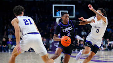 GCU guard Makaih Williams (2) dribbles against ACU guard Nasir DeGruy (0) during a game at Grand Canyon University on Jan. 16, 2025, in Phoenix.