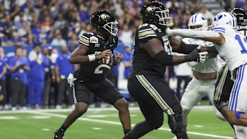 Dec 28, 2024; San Antonio, TX, USA; Colorado Buffaloes quarterback Shedeur Sanders (2) drops back in the pocket on a play during the first quarter against the Brigham Young Cougars at Alamodome. Mandatory Credit: Troy Taormina-Imagn Images