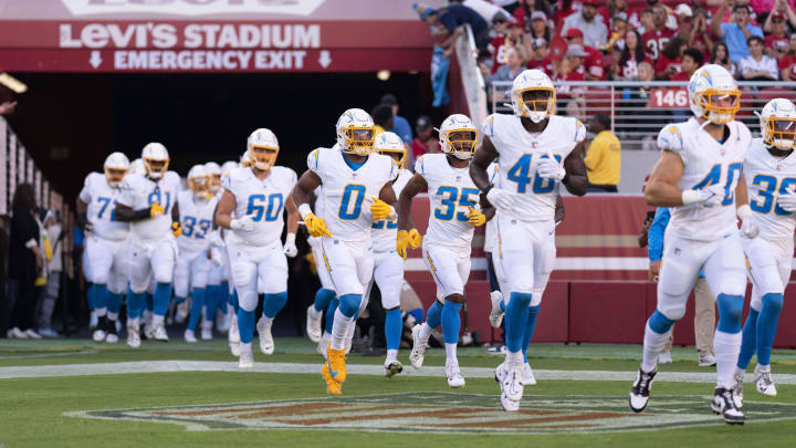 Aug 25, 2023; Santa Clara, California, USA;  Los Angeles Chargers linebacker Daiyan Henley (0) runs out of the tunnel with his teammates before the start of the first quarter against the San Francisco 49ers at Levi's Stadium. Mandatory Credit: Stan Szeto-USA TODAY Sports