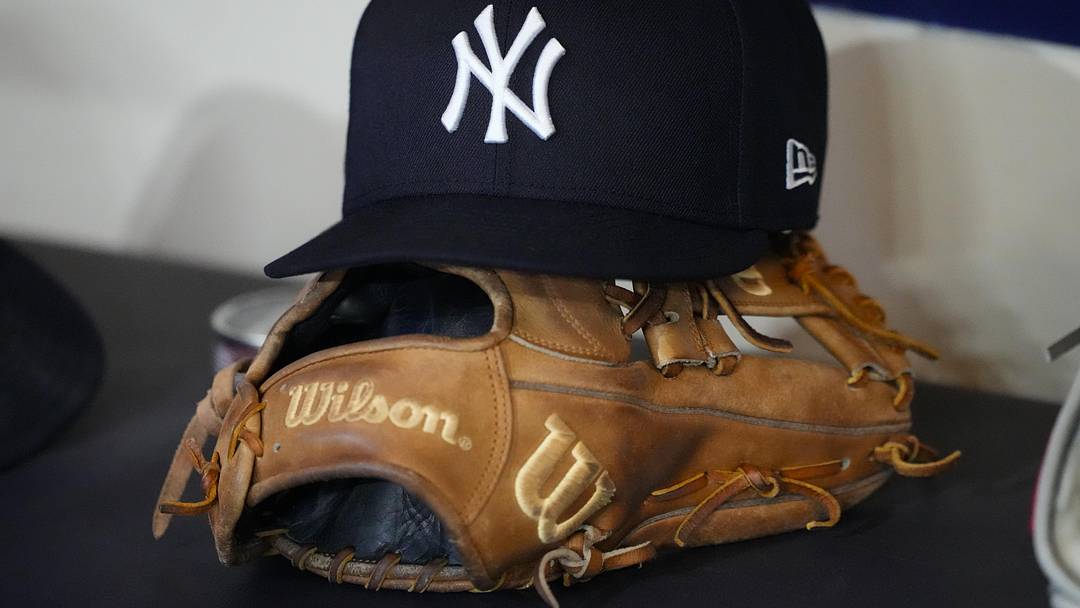 May 8, 2026; Milwaukee, Wisconsin, USA;  General view of a New York Yankees hat and glove prior to the game against the Milwaukee Brewers at American Family Field. Mandatory Credit: Jeff Hanisch-Imagn Images
