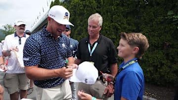Aug 16, 2024; Greenbrier, West Virginia, USA; Bryson DeChambeau signs autographs at The Old White at the Greenbrier. Mandatory Credit: Bob Donnan-Imagn Images