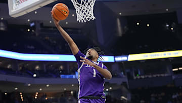 Dec 14, 2023; Milwaukee, Wisconsin, USA;  St. Thomas (MN) Tommies guard Kendall Blue (1) shoots during the first half against the Marquette Golden Eagles at Fiserv Forum.