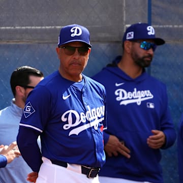 Feb 16, 2025; Glendale, AZ, USA; Los Angeles Dodgers manager Dave Roberts (30) looks on during a Spring Training workout at Camelback Ranch. Mandatory Credit: Joe Camporeale-Imagn Images