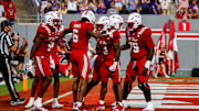 Aug 28, 2025; Raleigh, North Carolina, USA; North Carolina State Wolfpack wide receiver Wesley Grimes (6) celebrates a touchdown during the first half of the game against East Carolina Pirates at Carter-Finley Stadium. Mandatory Credit: Jaylynn Nash-Imagn Images