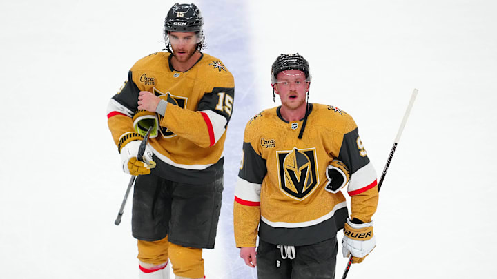 May 8, 2025; Las Vegas, Nevada, USA; Vegas Golden Knights defenseman Noah Hanifin (15) and center Jack Eichel (9) leave the ice after the Edmonton Oilers defeated the Golden Knights 5-4 in overtime of game two of the second round of the 2025 Stanley Cup Playoffs at T-Mobile Arena. Mandatory Credit: Stephen R. Sylvanie-Imagn Images