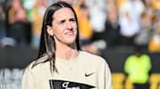 Oct 26, 2024; Iowa City, Iowa, USA; Former Iowa Hawkeye and current Indiana Fever WNBA star Caitlin Clark looks on while being honored during the game between the Iowa Hawkeyes and the Northwestern Wildcats at Kinnick Stadium. Mandatory Credit: Jeffrey Becker-Imagn Images