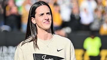 Oct 26, 2024; Iowa City, Iowa, USA; Former Iowa Hawkeye and current Indiana Fever WNBA star Caitlin Clark looks on while being honored during the game between the Iowa Hawkeyes and the Northwestern Wildcats at Kinnick Stadium. Mandatory Credit: Jeffrey Becker-Imagn Images