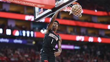 Nov 14, 2025; Houston, Texas, USA;  Houston Rockets guard Amen Thompson (1) dunks the ball during the second quarter against the Portland Trail Blazers at Toyota Center. Mandatory Credit: Troy Taormina-Imagn Images
