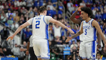 Mar 23, 2025; Raleigh, NC, USA; Duke Blue Devils forward Cooper Flagg (2) reacts after scoring a basket with Duke Blue Devils guard Tyrese Proctor (5) during the first half against the Baylor Bears in the second round of the NCAA Tournament at Lenovo Center. Mandatory Credit: Bob Donnan-Imagn Images
