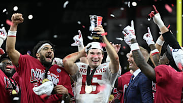 Indiana quarterback Fernando Mendoza celebrates with the MVP trophy after defeating Ohio State in the Big Ten championship game.
