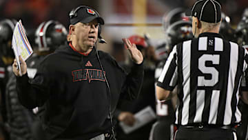 Nov 14, 2025; Louisville, Kentucky, USA;  Louisville Cardinals head coach Jeff Brohm talks with an official during the first half against the Clemson Tigers at L&N Federal Credit Union Stadium. Mandatory Credit: Jamie Rhodes-Imagn Images