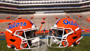Two helmets rest on Steve Spurrier-Florida Field before the start of the Orange and Blue game at Ben Hill Griffin Stadium in Gainesville, FL on Saturday, April 13, 2024. [Doug Engle/Gainesville Sun]2024