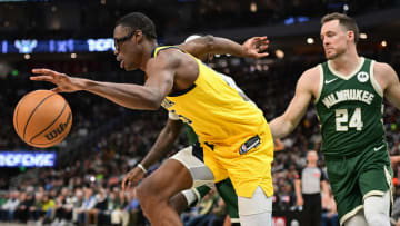 Apr 21, 2024; Milwaukee, Wisconsin, USA; Indiana Pacers forward Jalen Smith (25) drives away from Milwaukee Bucks guard Pat Connaughton (24) in the in the third quarter during game one of the first round for the 2024 NBA playoffs at Fiserv Forum. Mandatory Credit: Benny Sieu-USA TODAY Sports