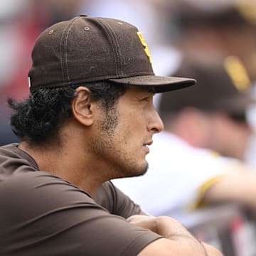 May 28, 2025; San Diego, California, USA; San Diego Padres pitcher Yu Darvish (1) looks out from the dugout during the third inning against the Miami Marlins at Petco Park. Mandatory Credit: Denis Poroy-Imagn Images