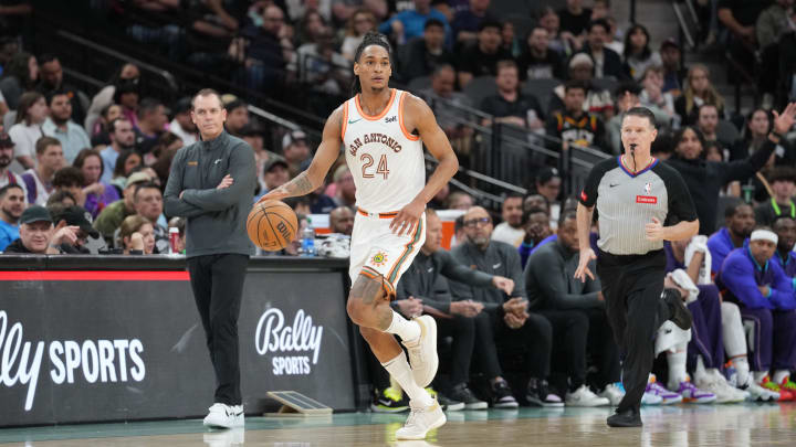 Mar 25, 2024; San Antonio, Texas, USA;  San Antonio Spurs guard Devin Vassell (24) dribbles in the first half against the Phoenix Suns at Frost Bank Center. Mandatory Credit: Daniel Dunn-USA TODAY Sports