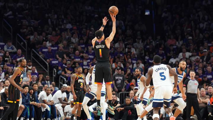 Apr 28, 2024; Phoenix, Arizona, USA; Phoenix Suns guard Devin Booker (1) shoots against the Minnesota Timberwolves during the first half of game four of the first round for the 2024 NBA playoffs at Footprint Center. Mandatory Credit: Joe Camporeale-USA TODAY Sports