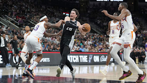 Mar 23, 2024; San Antonio, Texas, USA; San Antonio Spurs forward Cedi Osman (16) drives in against Phoenix Suns.