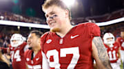 Nov 22, 2025; Stanford, California, USA; Stanford Cardinal defensive lineman Zach Rowell (97) reacts after taking possession of the axe after the game against the California Golden Bears at Stanford Stadium. Mandatory Credit: Sergio Estrada-Imagn Images