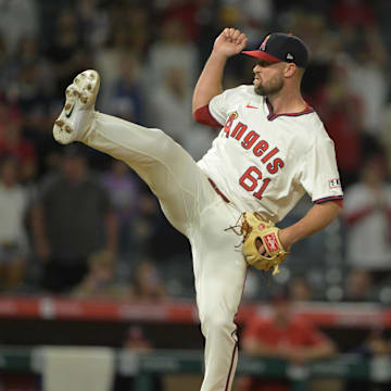 Jul 30, 2024; Anaheim, California, USA; Los Angeles Angels relief pitcher Hunter Strickland (61) earns a save in the ninth inning against the Colorado Rockies at Angel Stadium. Mandatory Credit: Jayne Kamin-Oncea-Imagn Images