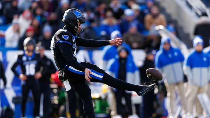 Nov 30, 2024; Lexington, Kentucky, USA; Kentucky Wildcats punter Aidan Laros (48) punts the ball during the first quarter against the Louisville Cardinals at Kroger Field. Mandatory Credit: Jordan Prather-Imagn Images