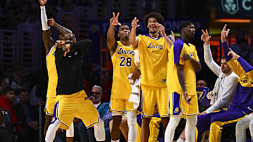 Apr 11, 2025; Los Angeles, California, USA; Los Angeles Lakers forward Jarred Vanderbilt (2), forward LeBron James (23), forward Rui Hachimura (28), center Jaxson Hayes (11), and Luka Doncic (77) celebrate after scoring against the Houston Rockets during the second half at Crypto.com Arena. Mandatory Credit: Jonathan Hui-Imagn Images