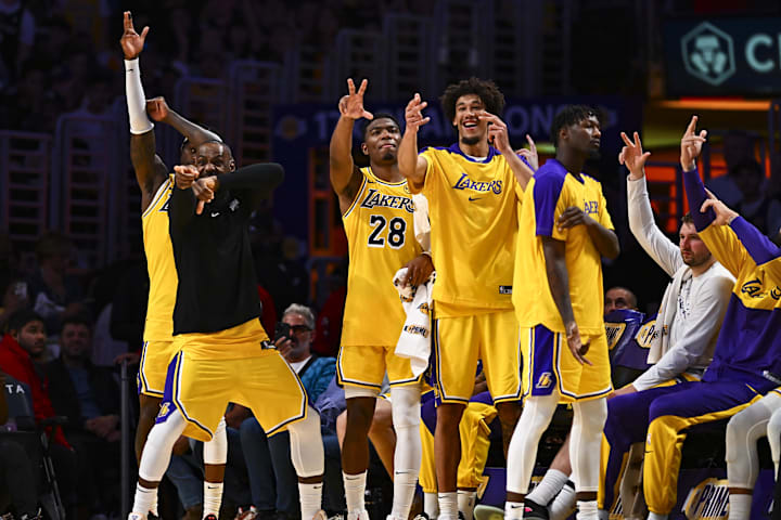 Los Angeles Lakers players celebrate after a big basket against the Houston Rockets. 