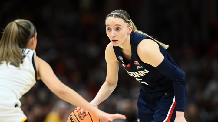 Connecticut Huskies guard Paige Bueckers (5) dribbles the ball against the Iowa Hawkeyes in the semifinals of the Final Four of the womens 2024 NCAA Tournament at Rocket Mortgage FieldHouse on April 5, 2024.