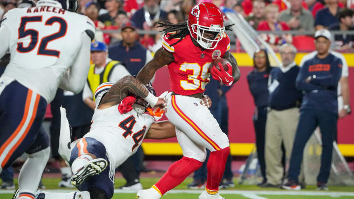 Aug 22, 2024; Kansas City, Missouri, USA; Kansas City Chiefs running back Emani Bailey (39) runs the ball as Chicago Bears linebacker Noah Sewell (44) makes the tackle during the first half at GEHA Field at Arrowhead Stadium. Mandatory Credit: Denny Medley-USA TODAY Sports