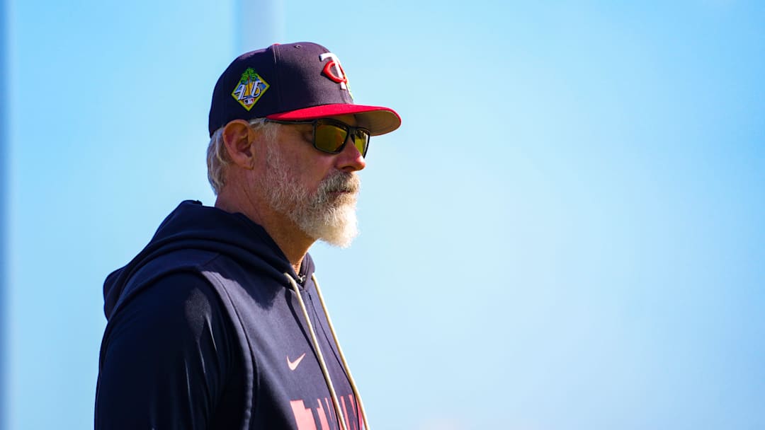 Derek Shelton walks near the dugout during the Minnesota Twins first full-squad workout of spring training.