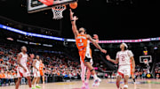Nov 28, 2024; Kansas City, Missouri, USA; Illinois Fighting Illini guard Kylan Boswell (4) shoots the ball during the second half against the Arkansas Razorbacks at T-Mobile Center. Mandatory Credit: William Purnell-Imagn Images
