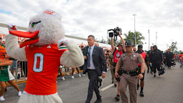 Oct 17, 2025; Miami Gardens, Florida, USA; Miami Hurricanes head coach Mario Cristobal during the Hurricane Walk before the game against the Louisville Cardinals at Hard Rock Stadium. Mandatory Credit: Sam Navarro-Imagn Images
