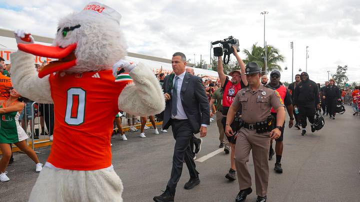 Oct 17, 2025; Miami Gardens, Florida, USA; Miami Hurricanes head coach Mario Cristobal during the Hurricane Walk before the game against the Louisville Cardinals at Hard Rock Stadium. Mandatory Credit: Sam Navarro-Imagn Images