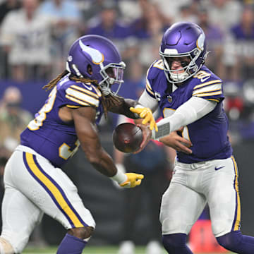 Sep 14, 2025; Minneapolis, Minnesota, USA; Minnesota Vikings quarterback J.J. McCarthy (9) hands off the ball to Minnesota Vikings running back Aaron Jones Sr. (33) during the first half at U.S. Bank Stadium. Mandatory Credit: Jeffrey Becker-Imagn Images