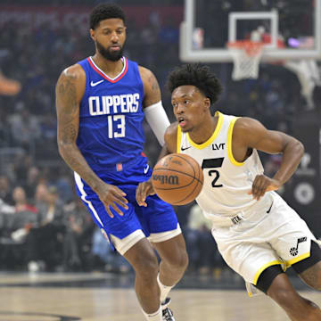 Apr 5, 2024; Los Angeles, California, USA; Utah Jazz guard Collin Sexton (2) takes the ball past Los Angeles Clippers forward Paul George (13) in the first half at Crypto.com Arena. Mandatory Credit: Jayne Kamin-Oncea-Imagn Images