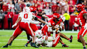 Cincinnati Bearcats quarterback Brendan Sorsby is tackled by Nebraska Cornhuskers defenders during the fourth quarter at GEHA Field at Arrowhead Stadium.