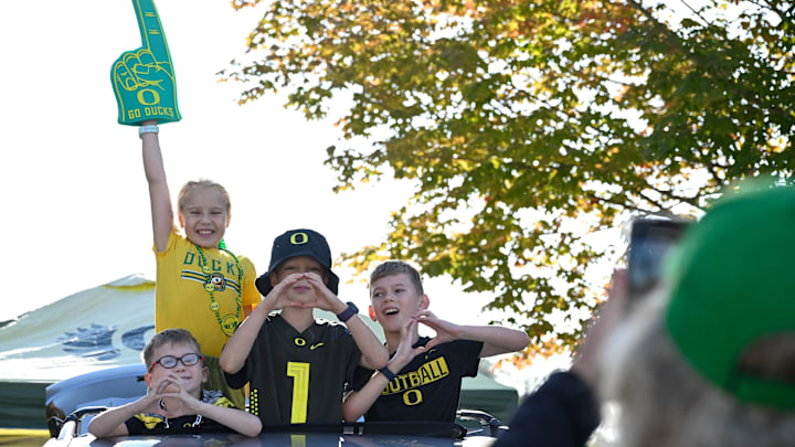 Sep 20, 2025; Eugene, Oregon, USA; Oregon Ducks fans pose for phot before the game between the Oregon Ducks and the Oregon State Beavers at Autzen Stadium. Mandatory Credit: Troy Wayrynen-Imagn Images