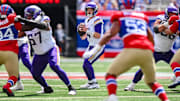 Sep 8, 2024; East Rutherford, New Jersey, USA; Minnesota Vikings quarterback Sam Darnold (14) looks to pass the ball against the New York Giants during the first half at MetLife Stadium. Mandatory Credit: John Jones-Imagn Images