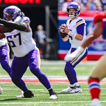 Sep 8, 2024; East Rutherford, New Jersey, USA; Minnesota Vikings quarterback Sam Darnold (14) looks to pass the ball against the New York Giants during the first half at MetLife Stadium. Mandatory Credit: John Jones-Imagn Images