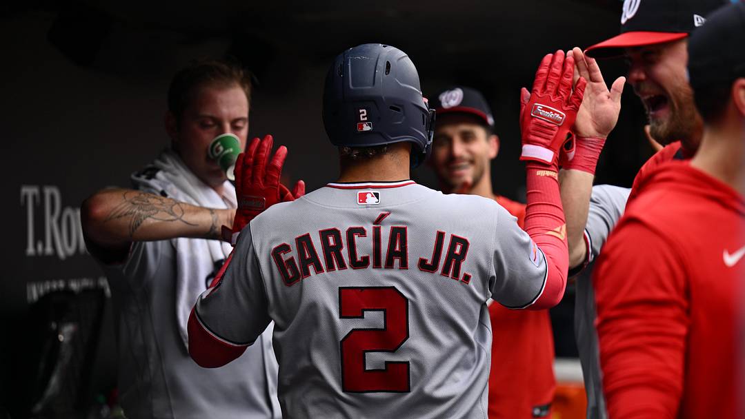 Jun 28, 2026; Baltimore, Maryland, USA;  Washington Nationals infielder Luis Garcia Jr. (2) celebrates in the dugout after hitting his second home run against the Baltimore Orioles in the seventh inning at Oriole Park at Camden Yards. Mandatory Credit: Jamie Sabau-Imagn Images